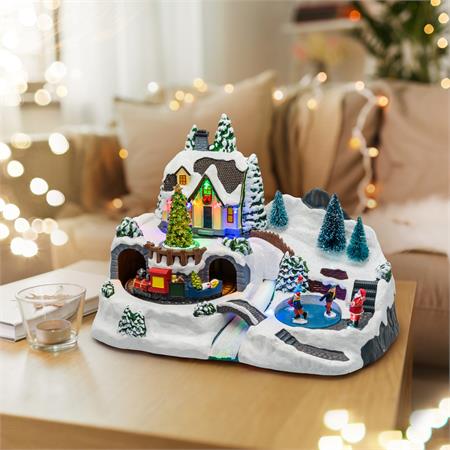 villaggio di natale in movimento con trenino pattinatori e albero di natale luci led e musiche